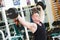 Bodybuilder lifting weight at sport gym