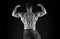 Bodybuilder perfect shape rear view. Strong bodybuilder flexing arms muscles black background. Fit bodybuilder showing