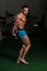 Bodybuilder Performing Side Triceps Poses
