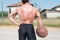 Bodybuilder Playing Basketball Holding Ball