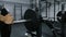 Bodybuilder / Powerlifter adding weight to barbell benchpress