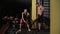 Bodybuilder teaches exercise his girlfriend. Athletic young woman doing some crossfit exercises with a rope