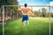 bodybuilder working out in park, doing chin ups and push ups. Male fitness player training outdoors