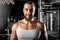 Bodybuilding. Bearded man standing at gym smiling happy to camera close-up