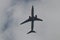 Boeing 737-900ER of Thai Lion Air flying in the cloudy sky