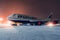 Boeing 747-400 Transaero parked at the airport at night