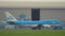 Boeing 747-406-M- of KLM airlines rides past the hangar of KLM
