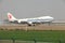 A boeing 747 cargo landing on the runway