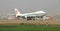 A boeing 747 cargo landing on the runway