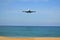 Boeing 777 landing on the tropical island of