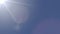 Boeing 787 passenger airplane flying across the sky against the sun, 4K video