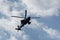 Boeing AH-64 attack helicopter on formation during an air show. Greek Air Force Apache flying on Thessaloniki, Greece during the