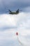 Boeing CH-47 Chinook helicopter dropping water from a water bucket. Gilze-RIjen, The Netherlands - June 21, 2014