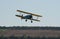 Boeing Stearman biplane flies low