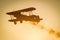 Boeing Stearman biplane flying during sunset