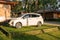 Bogor May 2023 - Nissan Livina car is parked at a charming accommodation nestled amidst lush trees