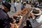 Bogota, Colombia - July 2nd 2023. Senior artisans selling pretty handmade birds made from seeds on the streets of downtown Bogota