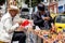 Bogota, Colombia - July 2nd 2023. Senior artisans selling pretty handmade birds made from seeds on the streets of downtown Bogota