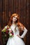 Boho bride with red hair posing