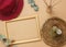 Boho style modern minimal home workspace desk with frame, succulent, hat, aroma sticks, napkins on beige background.