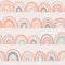 Boho style Seamless pattern with rainbows in doodle style in a natural color palette. Pastel naive nursery print design on a light