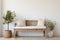 Boho white and beige interior with a wooden bench near the empty wall and green houseplants. Modern minimalist entryway in the