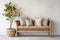 Boho white interior with a rattan bench near the empty wall and green houseplants. Modern minimalist entryway in the house.