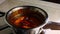 Boil a mixture of BBQ Brats. 4k video american cuisine recipe