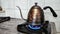 boil water in a kettle to make coffee and tea