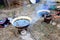 Boil water with material in old steel basin prepare ready for ma