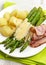Boiled asparagus, potatoes, bacon and hollands sauce