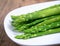 Boiled asparagus on white plate