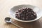 Boiled azuki beans placed against a wooden background