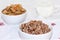 Boiled buckwheat cereal with milk and stew with carrots in a bowl on a light table. Traditional Russian organic food, diet food,
