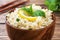 Boiled bulgur with fresh lemon and mint on a plate. A traditional oriental dish called Tabouleh. wooden background rustic