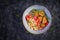 Boiled bulgur, roasted chicken nuggets and fresh tomatoes salad.