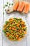 Boiled carrots with green peas