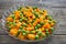 Boiled carrots with green peas