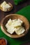 Boiled cassava on rustic bowl. Served with `sambal or chili sauce.1