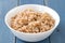 Boiled cereals in bowl on blue background