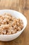 Boiled cereals in white bowl