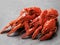 Boiled crayfish isolated on a black stone background. Close-up