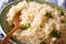 Boiled crumbly bulgur with herbs macro on a plate. horizontal