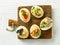 Boiled decorative eggs on wooden cutting board