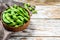 Boiled edamame Beans in a pan. White background. Top view. Copy space