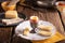 Boiled egg in a silver eggcup with bread