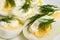 Boiled eggs with mayonnaise and dill.