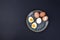 Boiled eggs on a plate. Black background. Place for text. Protein and nutrition.