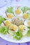 Boiled eggs with salad, sprouts, cucumber and radi