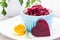 Boiled grated beet in a bowl and chiken egg